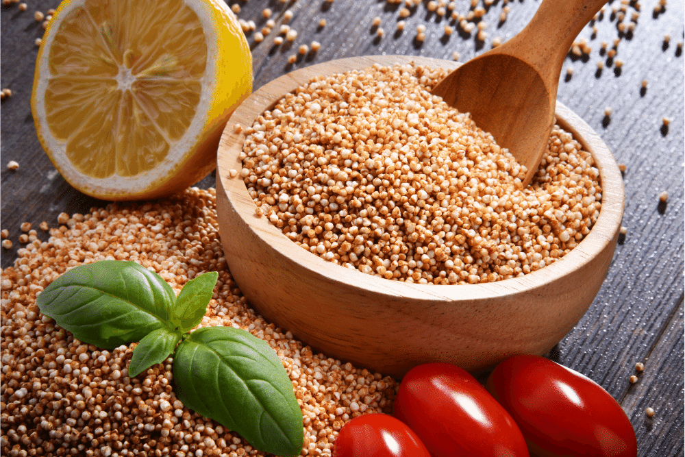 Bowl of amaranth grain on wooden table