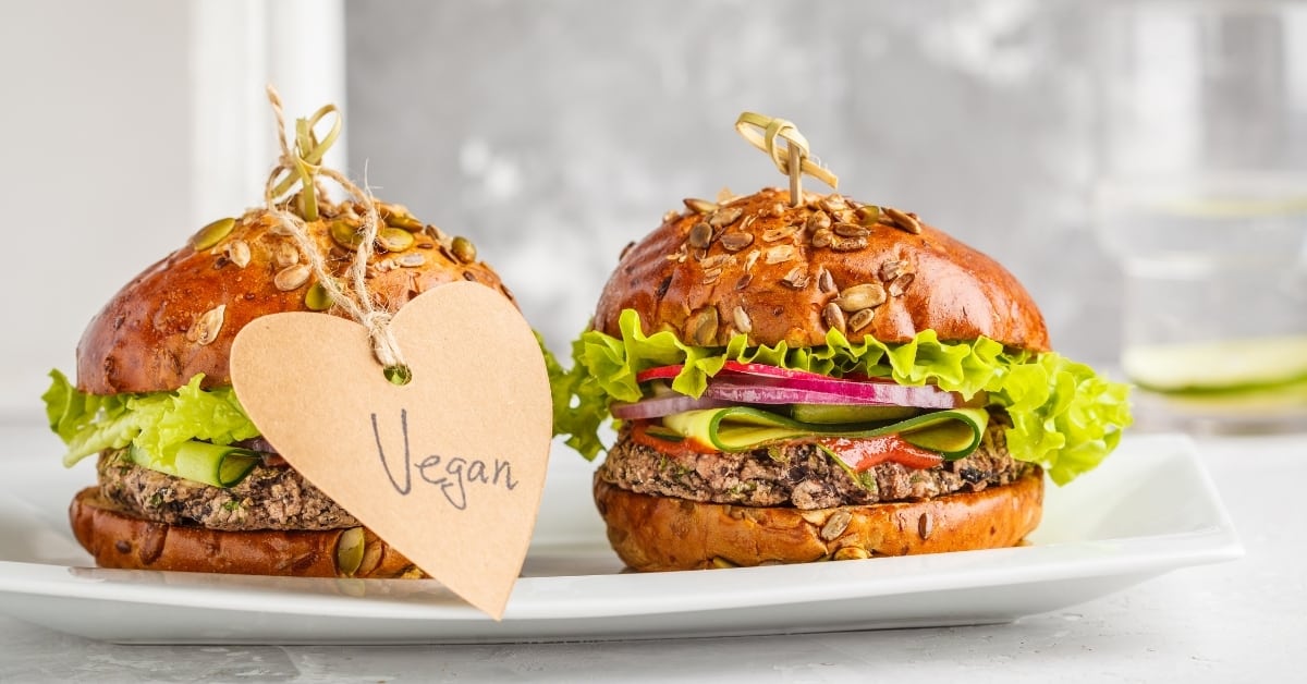 Vegan bean burgers with vegetables and tomato sauce on